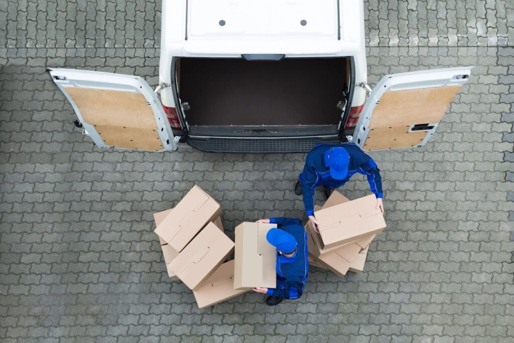 Nashua Workers Compensation Lawyer features photo of package delivery drivers to show an example of workers who might suffer from injuries due to repetitive motion